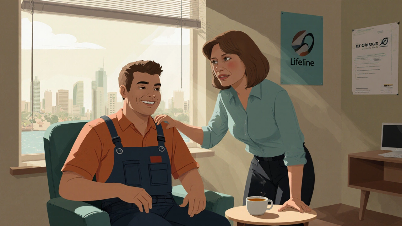 Electrician and supportive boss speaking in a calm workplace break room.